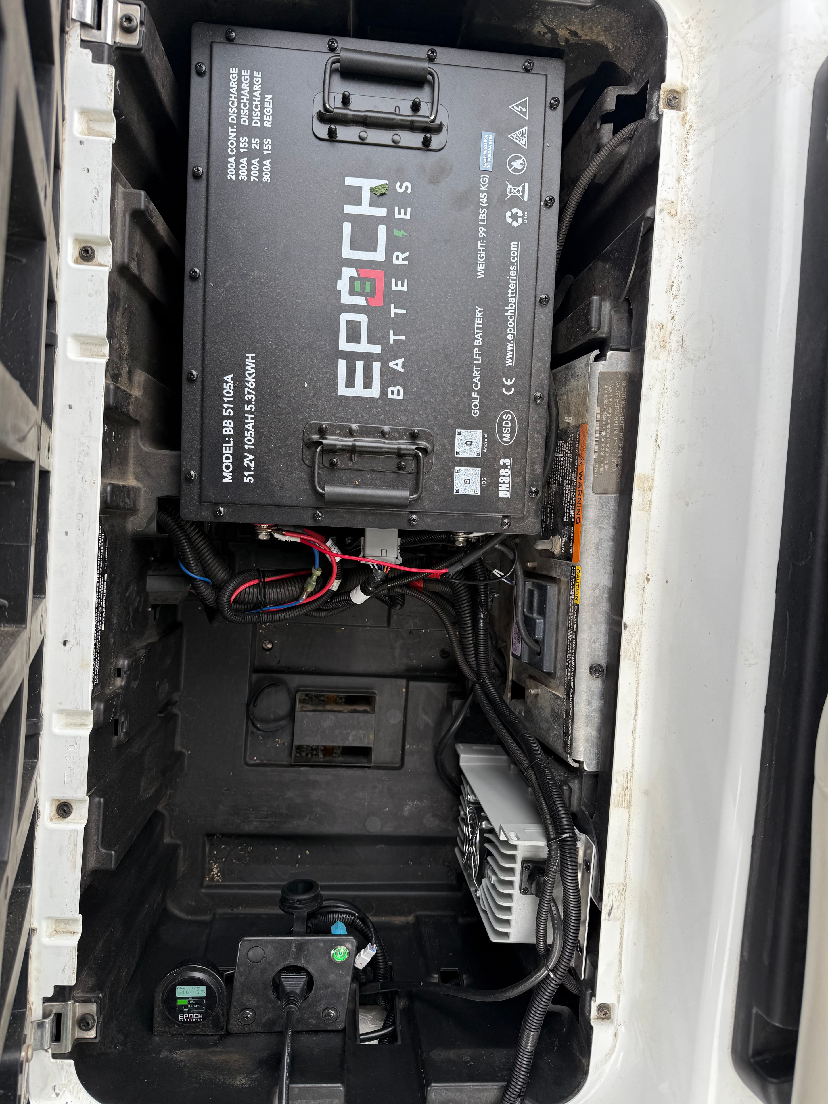 Epoch lithium battery system installed in a white golf cart