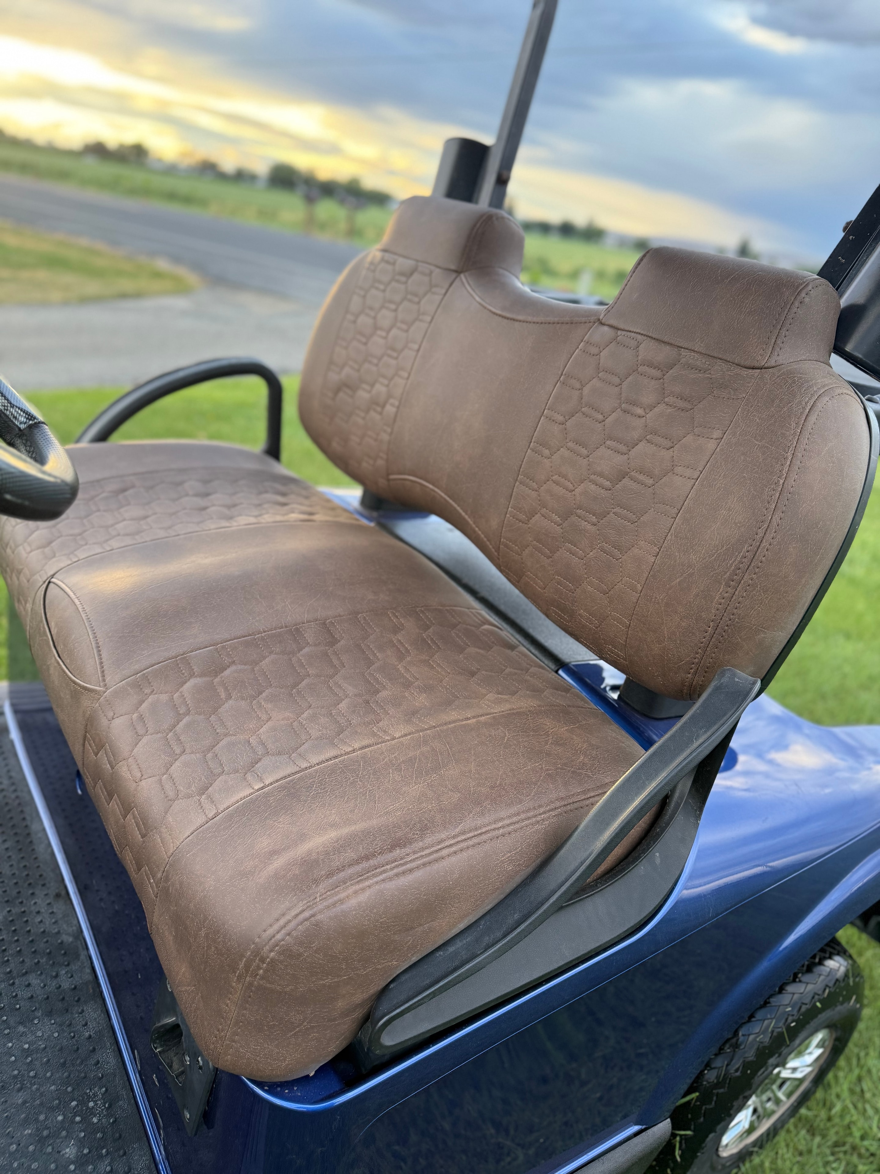 Blue golf cart with brown custom upholstery