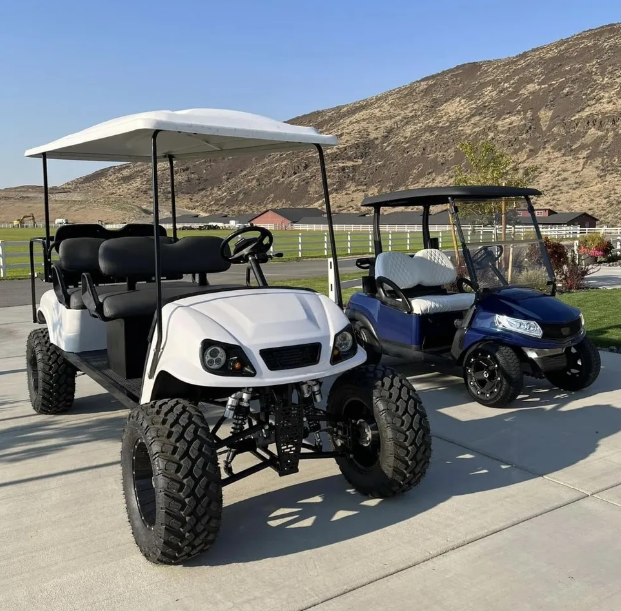 White and blue golf carts outdoors