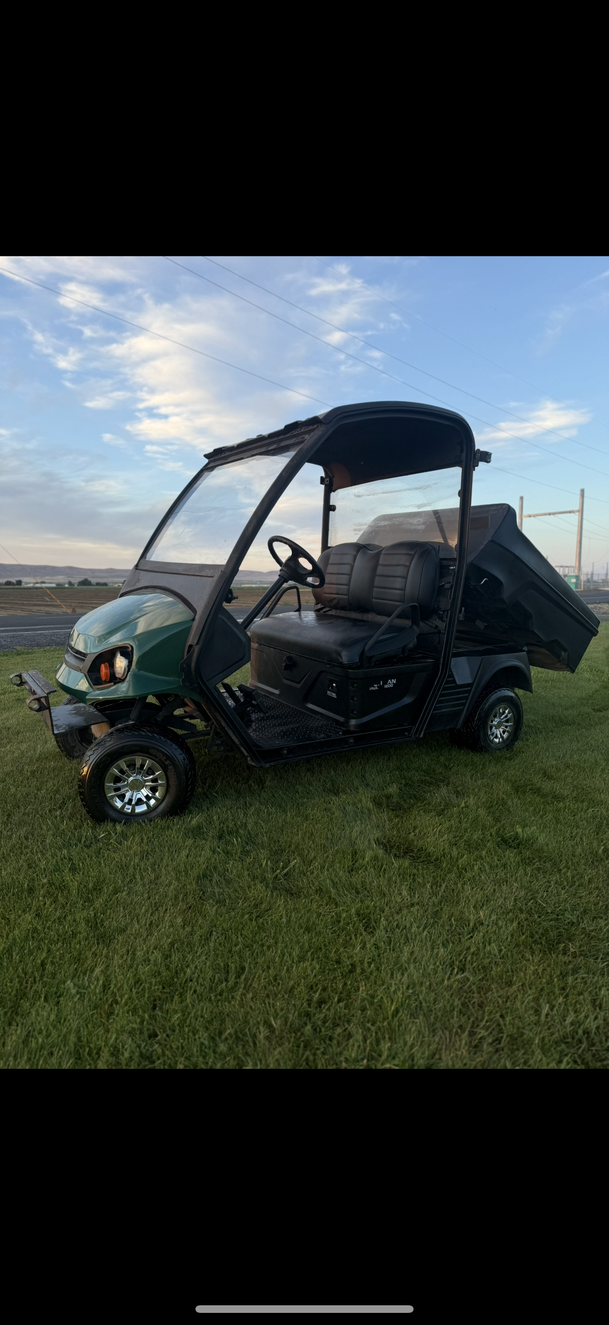 Green utility golf cart with rear dump bed